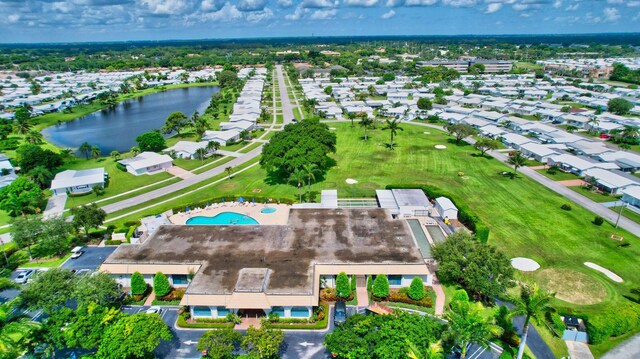 bird's eye view with a water view and a residential view