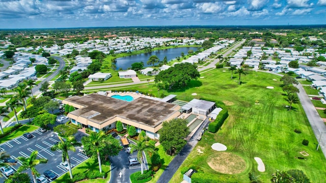 drone / aerial view featuring a water view and a residential view