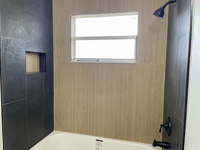 bathroom with shower / tub combination