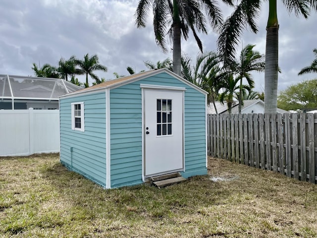 view of shed featuring a fenced backyard