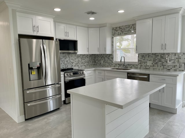 kitchen featuring a sink, light countertops, visible vents, and stainless steel appliances