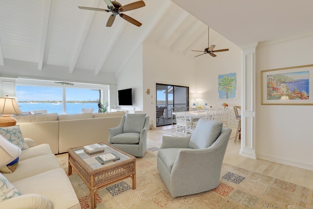 living room with high vaulted ceiling, light wood-style floors, beam ceiling, and plenty of natural light