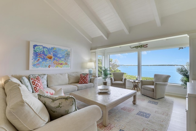 living area with high vaulted ceiling, light wood finished floors, a water view, and beam ceiling