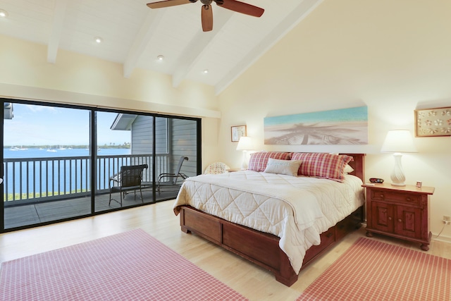 bedroom with high vaulted ceiling, a water view, light wood-style floors, access to exterior, and beamed ceiling