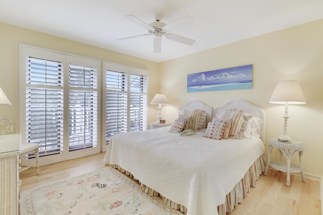 bedroom with a ceiling fan and wood finished floors