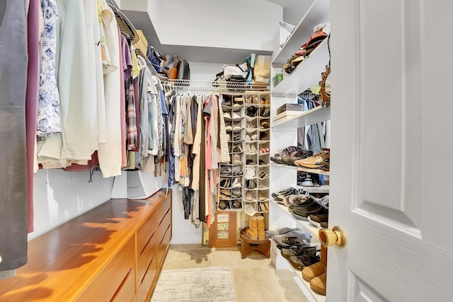 spacious closet featuring tile patterned floors