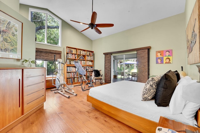 bedroom featuring light wood-style floors, access to outside, multiple windows, and high vaulted ceiling