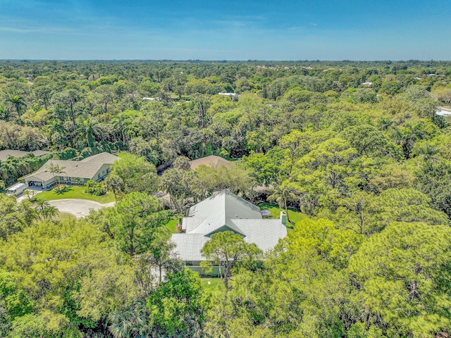 aerial view featuring a wooded view