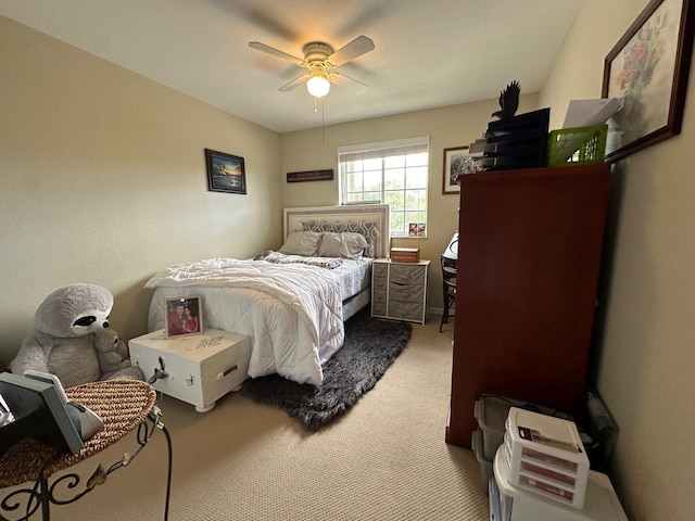 bedroom with carpet and a ceiling fan