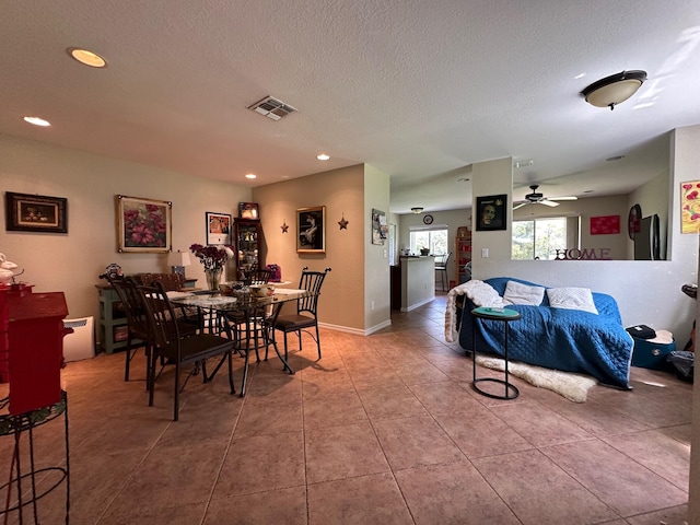 tiled dining room with a ceiling fan, baseboards, visible vents, recessed lighting, and a textured ceiling