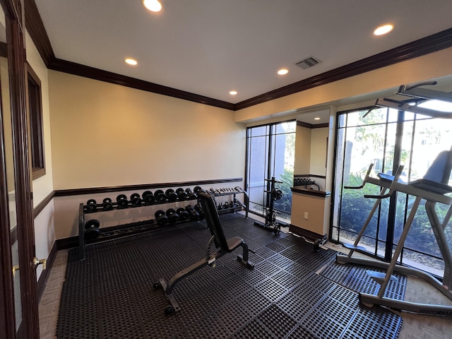 gym with baseboards, recessed lighting, visible vents, and crown molding