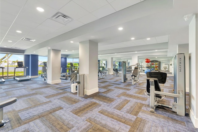 exercise room featuring recessed lighting, carpet, visible vents, and baseboards