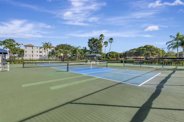 view of sport court featuring fence