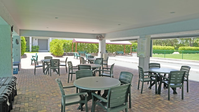 view of patio with fence and outdoor dining area