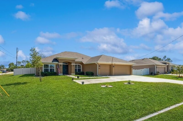 view of front of home featuring stucco siding, driveway, fence, a front yard, and an attached garage