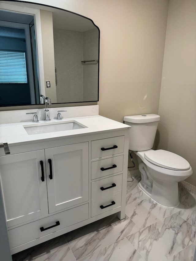 774 Burgundy Q, Delray Beach, FL 33484 - bathroom featuring toilet, marble finish floor, and vanity
