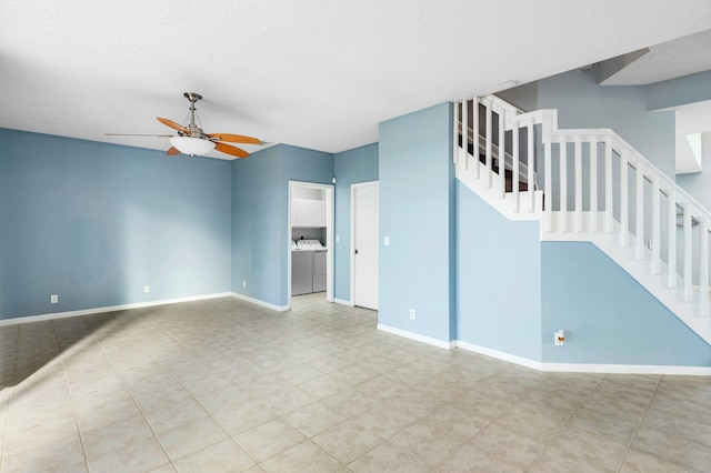 unfurnished living room featuring baseboards, stairs, and ceiling fan