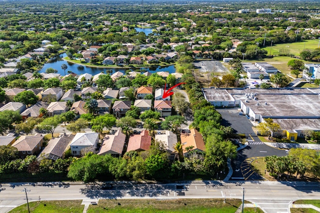 birds eye view of property featuring a residential view and a water view