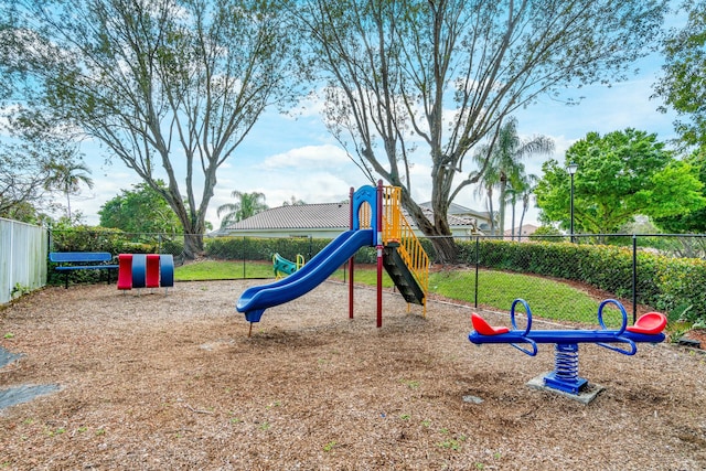 community jungle gym featuring fence