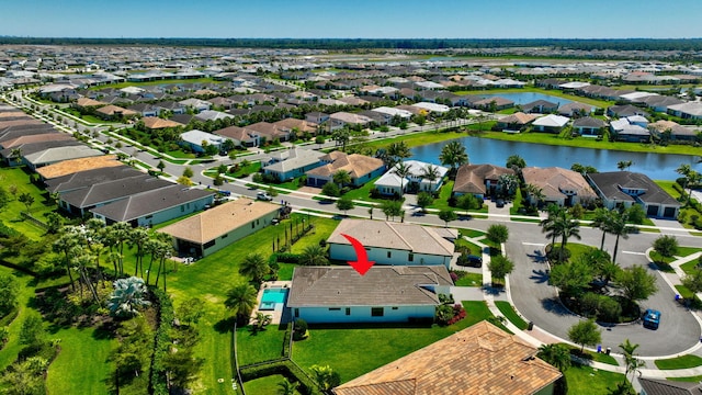 bird's eye view featuring a residential view and a water view