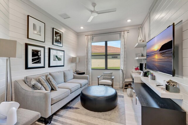 living room with recessed lighting, wood finished floors, and ceiling fan