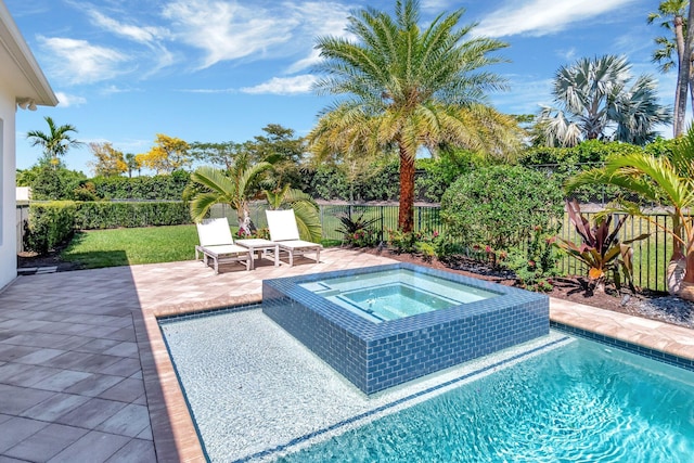 view of pool with an in ground hot tub, a fenced backyard, and a patio area