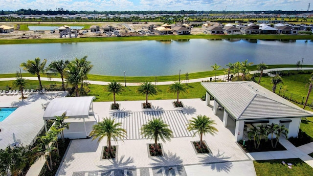 drone / aerial view with a residential view and a water view