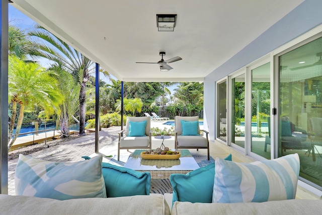 view of patio with an outdoor pool, an outdoor hangout area, ceiling fan, and fence