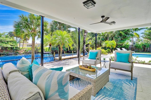 view of patio with an outdoor living space, a fenced in pool, fence, and ceiling fan