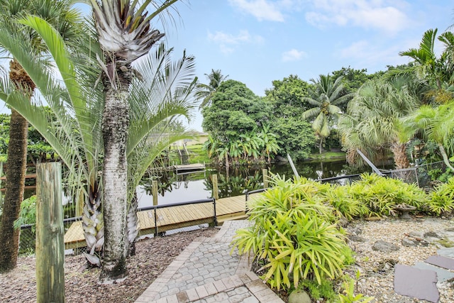 view of yard with fence and a water view