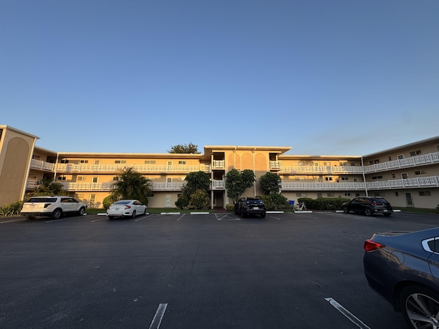 view of property with uncovered parking