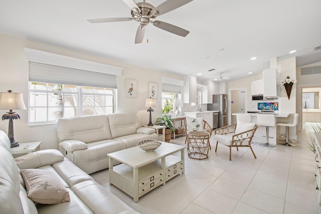 living room featuring light tile patterned floors, recessed lighting, ceiling fan, and lofted ceiling