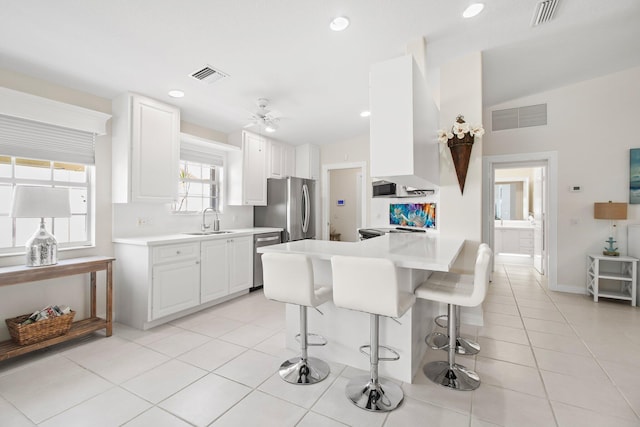 kitchen featuring a sink, visible vents, and stainless steel appliances