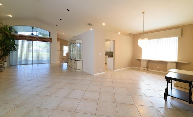 10102 Diamond Lake Rd, Boynton Beach, FL 33437 - empty room featuring lofted ceiling, recessed lighting, light tile patterned floors, baseboards, and a chandelier