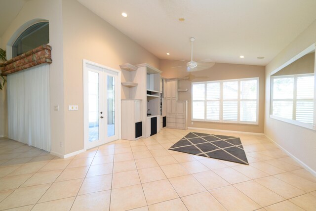 10102 Diamond Lake Rd, Boynton Beach, FL 33437 - unfurnished living room with baseboards, vaulted ceiling, light tile patterned floors, recessed lighting, and french doors