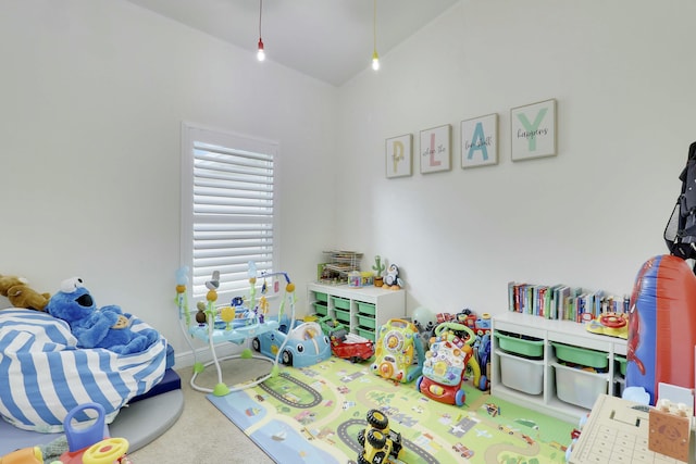 game room featuring carpet floors, baseboards, and lofted ceiling