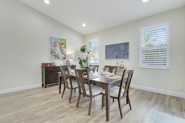 dining area with light wood-type flooring, vaulted ceiling, baseboards, and recessed lighting