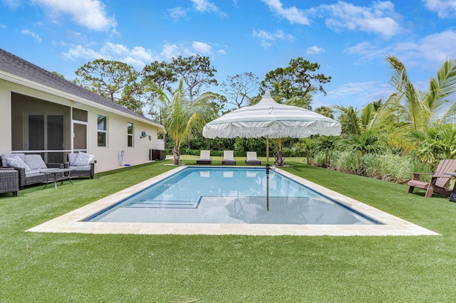 outdoor pool featuring a yard and a patio area