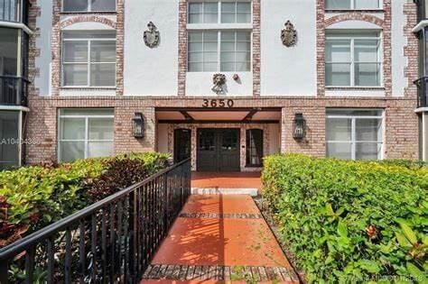 view of exterior entry featuring brick siding