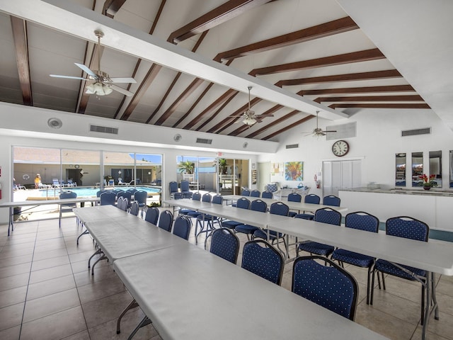 tiled dining space featuring high vaulted ceiling, beam ceiling, and visible vents