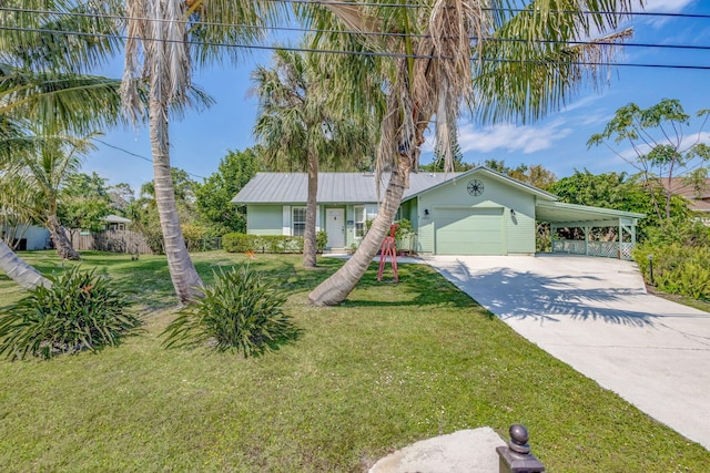 ranch-style house featuring a garage, a carport, concrete driveway, and a front yard