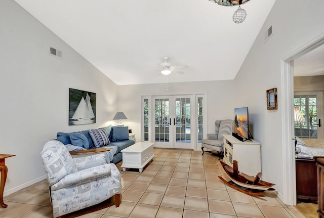 living room with light tile patterned floors, french doors, high vaulted ceiling, and visible vents