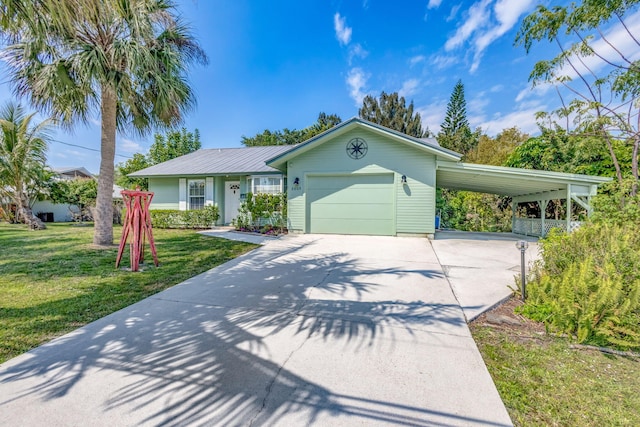 single story home with a garage, concrete driveway, and a front yard