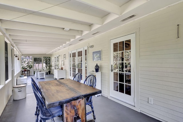 sunroom with visible vents and beamed ceiling