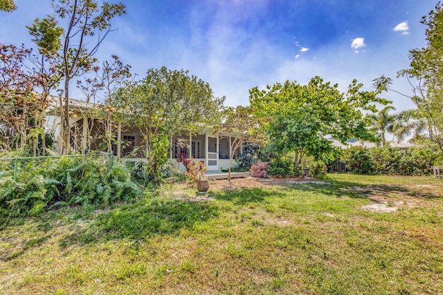 view of yard featuring a sunroom