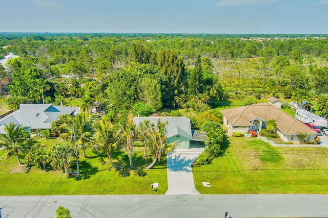 drone / aerial view featuring a view of trees