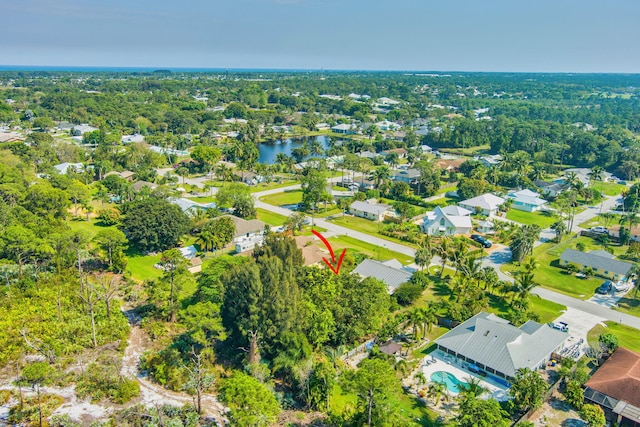 bird's eye view with a forest view, a residential view, and a water view