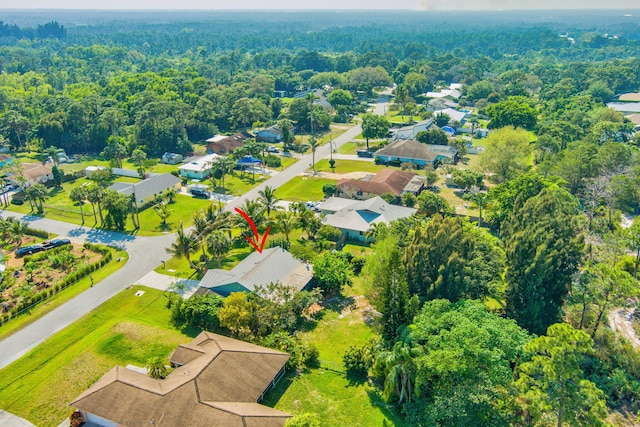 bird's eye view featuring a residential view and a view of trees