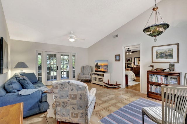 living area featuring light tile patterned floors, french doors, visible vents, and ceiling fan