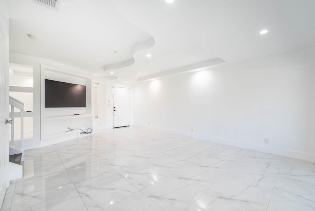 unfurnished living room featuring recessed lighting, visible vents, marble finish floor, and baseboards